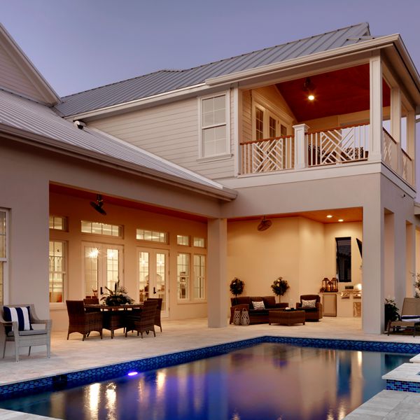 Outdoor Kitchen and Pool Area At Key West Two Story By Custom Home Builder Camlin Custom Homes